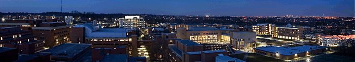 Evening falls on the UMBC campus with downtown Baltimore in the background.